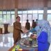 Pj Wako Sawahlunto Serahkan Bantuan BLT di Desa Muaro Kalaban